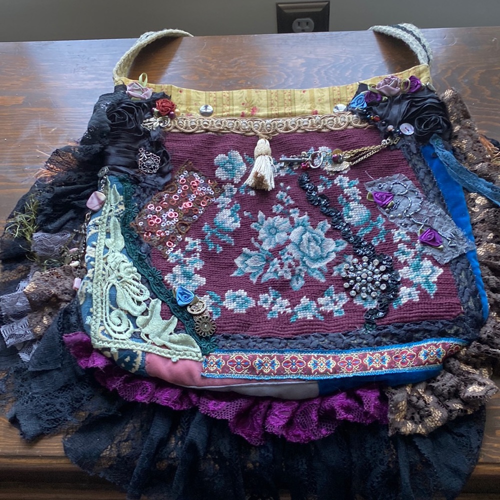 Patchwork handbag with lace and charms